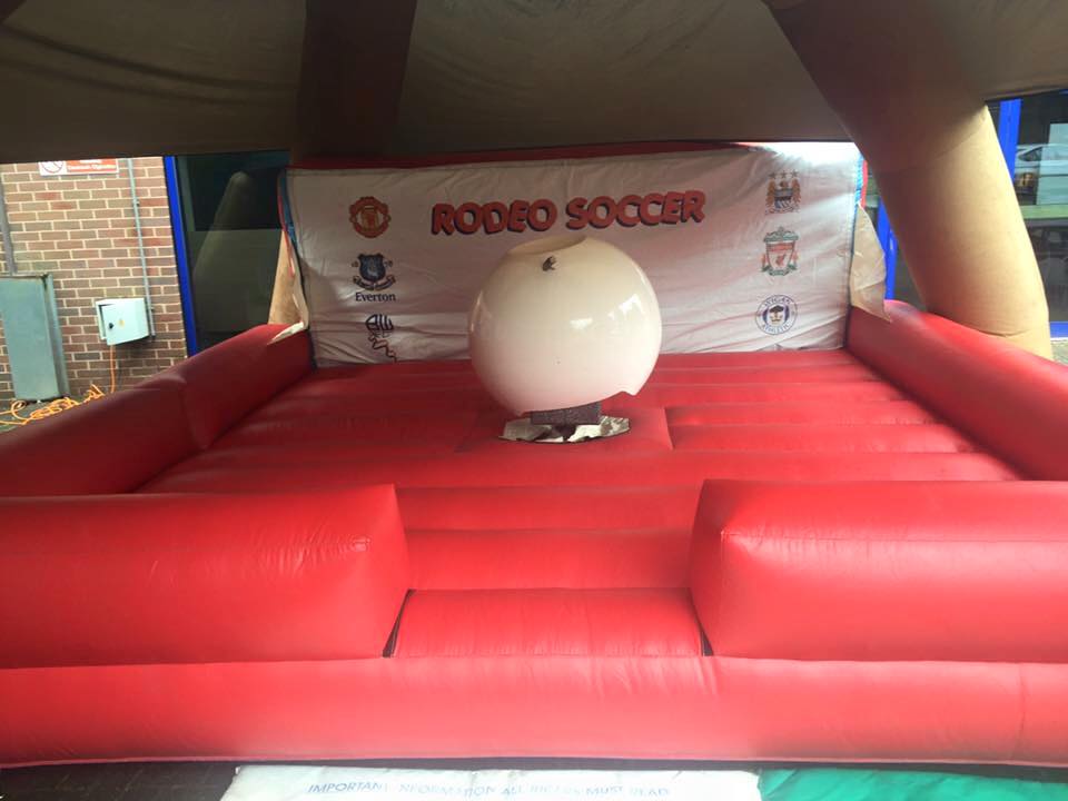 This image shows our fantastic rodeo football on hire in Wigan for a college open day. Great fun for students and staff. Rodeo Football on hire at Wigan and Leigh College in Wigan.